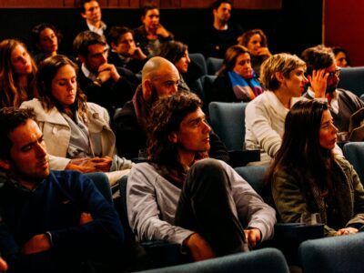 An audience watching a talk